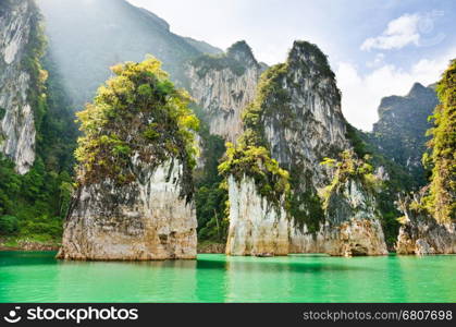 Travel island and green lake at Ratchaprapha Dam in Khao Sok National Park, Surat Thani Province, Thailand ( Guilin of Thailand )