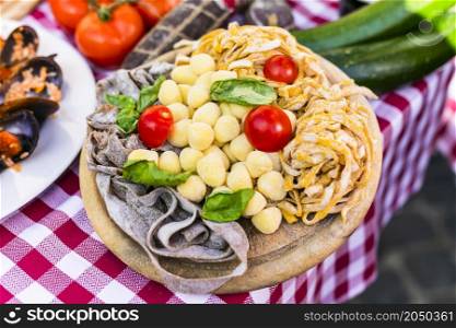 Travel Italy, Part of Italian culture - healthy mediterranean food. Rome street restaurants with variety of typical hand made pasta
