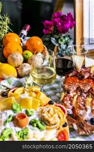 Travel Italy, Part of Italian culture - healthy mediterranean food. Rome street restaurants with variety of typical pasta, salami and wine.