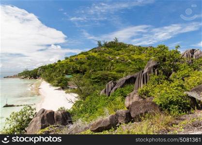 travel, landscape and nature concept - island beach in indian ocean on seychelles. island beach in indian ocean on seychelles