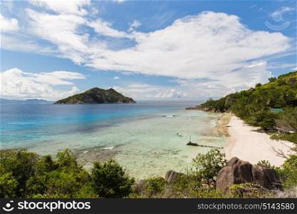 travel, landscape and nature concept - island beach in indian ocean on seychelles. island beach in indian ocean on seychelles