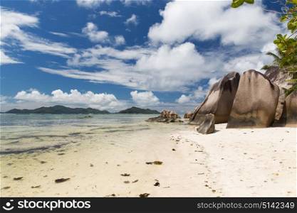 travel, landscape and nature concept - rocks on seychelles island beach in indian ocean. rocks on seychelles island beach in indian ocean