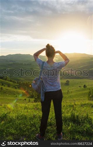Travel, lesure and real life concept - woman in Altai mountain, beauty summer landcape. Travel, lesure and real life concept