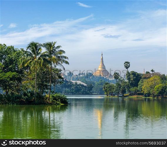 Travel Myanmar tourism background - view of Shwedagon Pagoda over Kandawgyi Lake in Yangon, Burma Myanmar