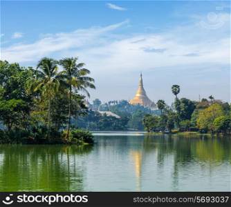 Travel Myanmar tourism background - view of Shwedagon Pagoda over Kandawgyi Lake in Yangon, Burma Myanmar