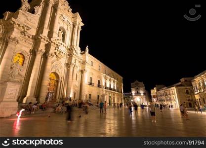 Travel Photography from Syracuse, Italy on the island of Sicily. Cathedral Plaza. Large open Square with summer nightlife.