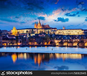 Travel Prague Europe concept background - view of Charles Bridge and Prague Castle in twilight. Prague, Czech Republic