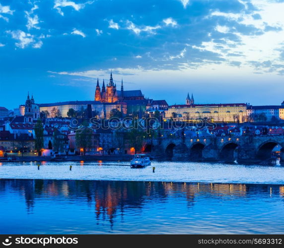 Travel Prague Europe concept background - view of Charles Bridge and Prague Castle in twilight. Prague, Czech Republic