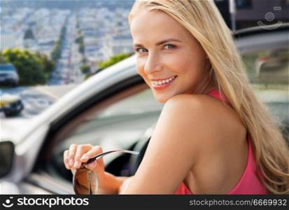 travel, road trip and people concept - close up of happy young woman in convertible car. happy young woman in convertible car. happy young woman in convertible car