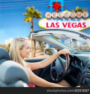 travel, road trip and people concept - happy young woman driving convertible car over welcome to fabulous las vegas sign background. happy woman driving convertible car at las vegas. happy woman driving convertible car at las vegas