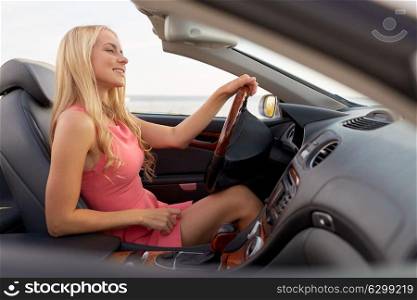 travel, road trip and people concept - happy young woman in convertible car. happy young woman in convertible car