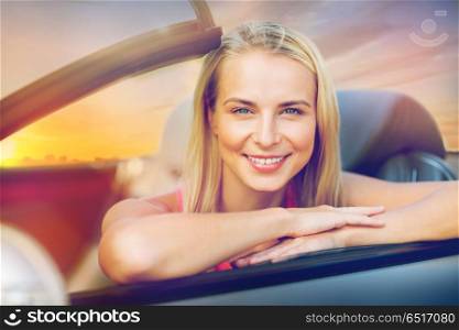 travel, road trip and people concept - happy young woman in convertible car. happy young woman in convertible car. happy young woman in convertible car