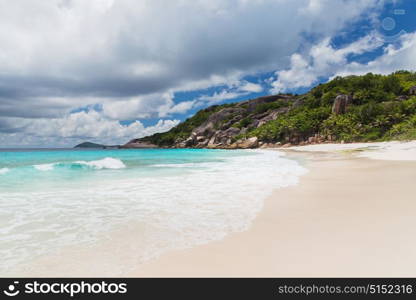 travel, seascape and nature concept - island beach in indian ocean on seychelles. island beach in indian ocean on seychelles