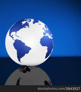 Travel, services and international business management concept with world map on a globe and blue background with copy space.