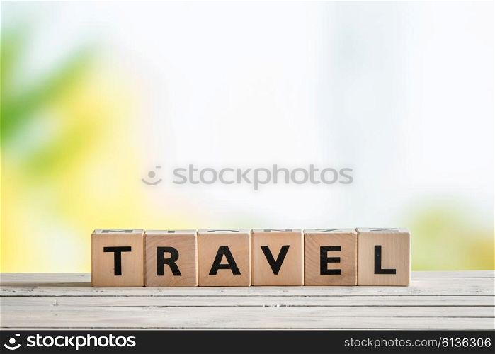 Travel sign on a wooden table in the nature