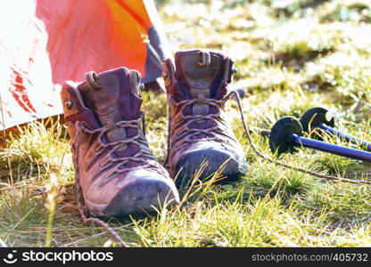 travel. the tourist goes on a hike through the mountains - a tent, boots and Trekking poles