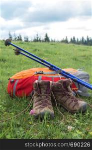 travel. the tourist goes on a hike through the mountains - a backpack, boots and Trekking poles