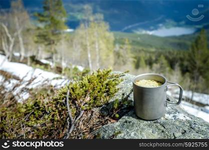 Travel titanium cup. Lunch during the journey to the wild. Camping lifestyle.
