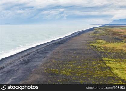 travel to Iceland - above view of Solheimafjara black beach from Dyrholaey promontory near Vik I Myrdal village on Atlantic South Coast in Katla Geopark in september