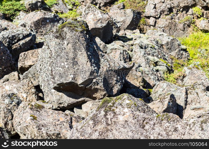 travel to Iceland - boulder in Almannagja Fault in Thingvellir national park in autumn