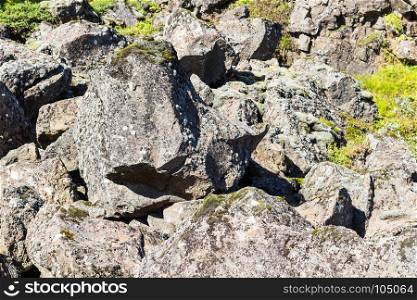 travel to Iceland - boulder in Almannagja Fault in Thingvellir national park in autumn