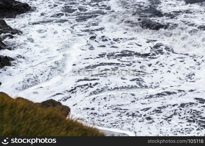 travel to Iceland - ocean surf near Vik I Myrdal village on Atlantic South Coast in Katla Geopark in september