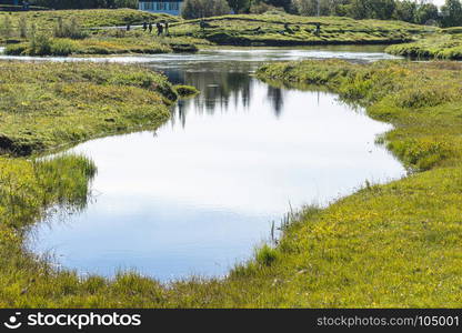 travel to Iceland - ponds in valley of Oxara river in Thingvellir national park in september