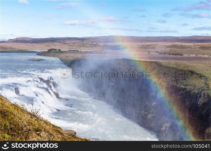 travel to Iceland - rainbow over Gullfoss waterfall in canyon of Olfusa river in september