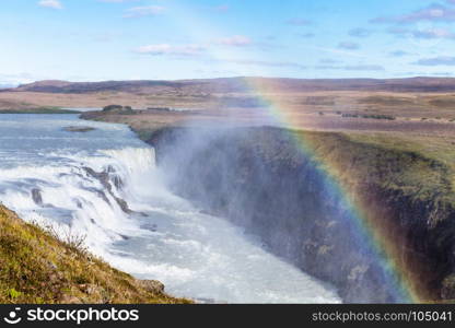 travel to Iceland - rainbow over Gullfoss waterfall in canyon of Olfusa river in september