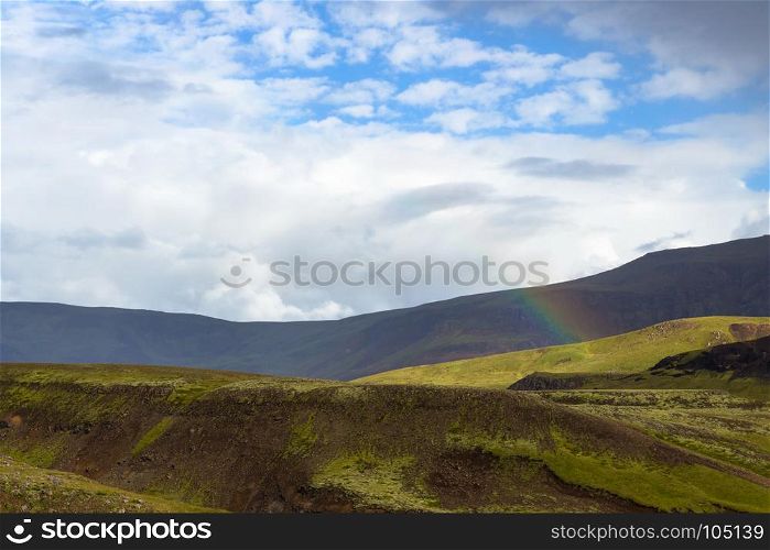 travel to Iceland - rainbow over mountains in Hveragerdi Hot Spring River Trail area in september