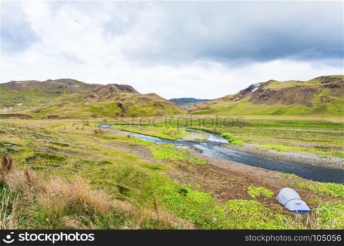 travel to Iceland - tourist tent in valley of Varma river in Hveragerdi Hot Spring River Trail area in september