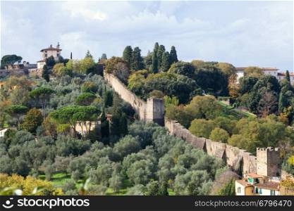 travel to Italy - above view of green gardens and wall of Giardino Bardini from Piazzale Michelangelo in Florence city in autumn