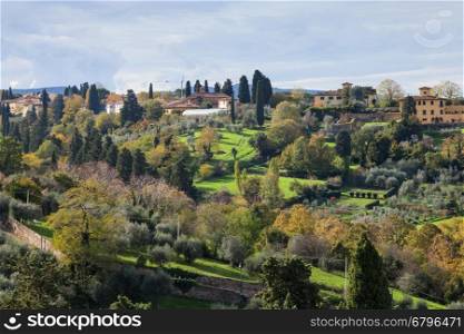 travel to Italy - above view of green gardens in suburb of Florence city from Piazzale Michelangelo in Florence city in autumn