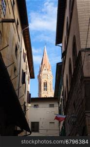 travel to Italy - bell tower of church Badia Fiorentina in Fraternity of Jerusalem abbey over old street in Florence city