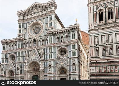 travel to Italy - decorated facade of Duomo Cathedral Santa Maria del Fiore and Giotto's Campanile in Florence city