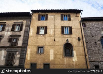 travel to Italy - facades of old apartment buildings on street in historic centre of Florence city