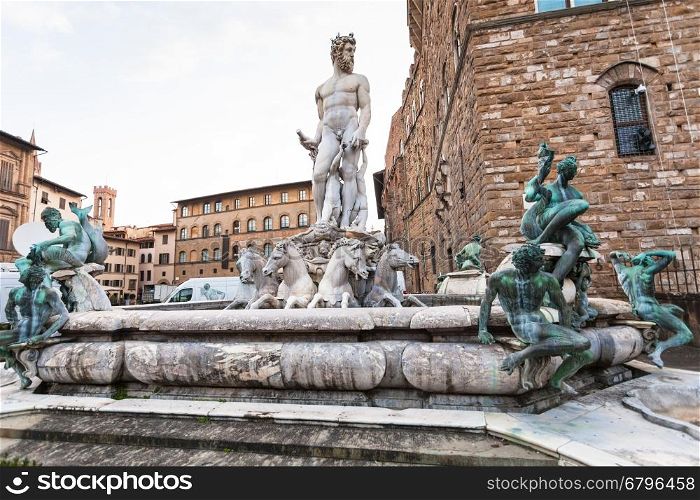 travel to Italy - Fountain of Neptune near Palazzo Vecchio on Piazza della Signoria in Florence in morning.