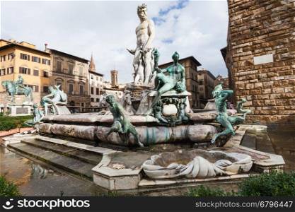 travel to Italy - Piazza della Signoria and wet Fountain of Neptune in Florence city in autumn after rain