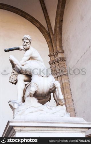 travel to Italy - statue hercules and nessus on Piazza della Signoria in Florence city. Hercules beating the Centaur Nessus is marble sculpture by Pietro Francavilla in 1599