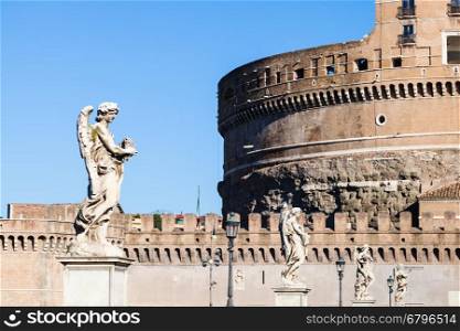 travel to Italy - statues of Angels on bridge Ponte Sant Angelo near the Castel in Rome city