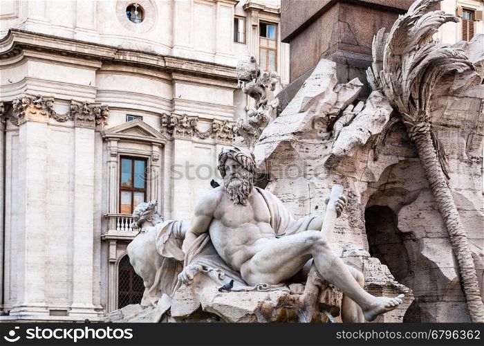 travel to Italy - statues of Fontana dei Quattro Fiumi (Fountain of the Four Rivers) on Piazza Navona in Rome city