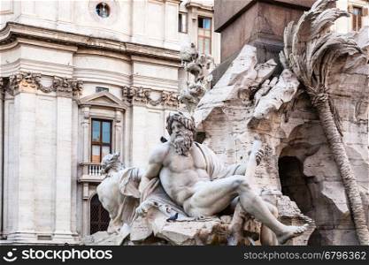 travel to Italy - statues of Fontana dei Quattro Fiumi (Fountain of the Four Rivers) on Piazza Navona in Rome city