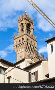 travel to Italy - tower of Palazzo Vecchio over houses in Florence city