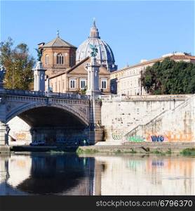 travel to Italy - view of dome of St. Peter's Basilica and bridge Ponte Vittorio Emanuele II from Tiber river in Rome
