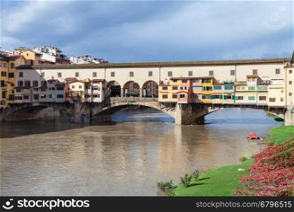 travel to Italy - view of Ponte Vecchio (Old Bridge) over Arno river in Florence city in sunny autumn day