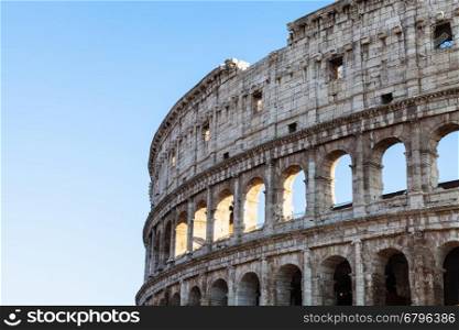 travel to Italy - walls of ancient roman amphitheatre Coliseum in Rome city in evening