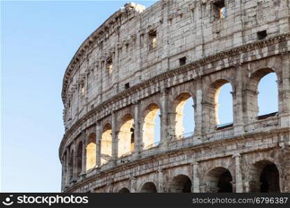 travel to Italy - walls of ancient roman amphitheatre Colosseum in Rome city in evening