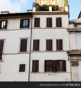 travel to Italy - white facades of urban houses in medieval district of Rome city
