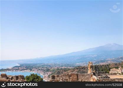 travel to Sicily, Italy - blue sky over Mount Etna, Giardini Naxos town on Ionian sea coast and Taormina city in summer day