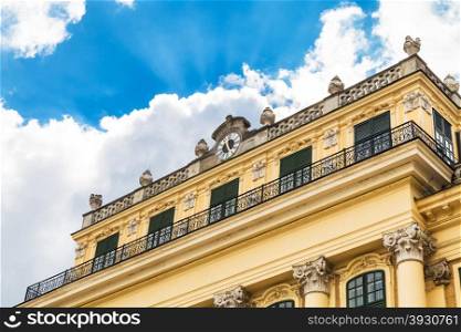 travel to Vienna city - facade of Schloss Schonbrunn palace and white cloud in blue sky, Vienna, Austria